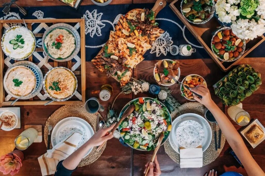 Traditional Greek wedding feast with various dishes.