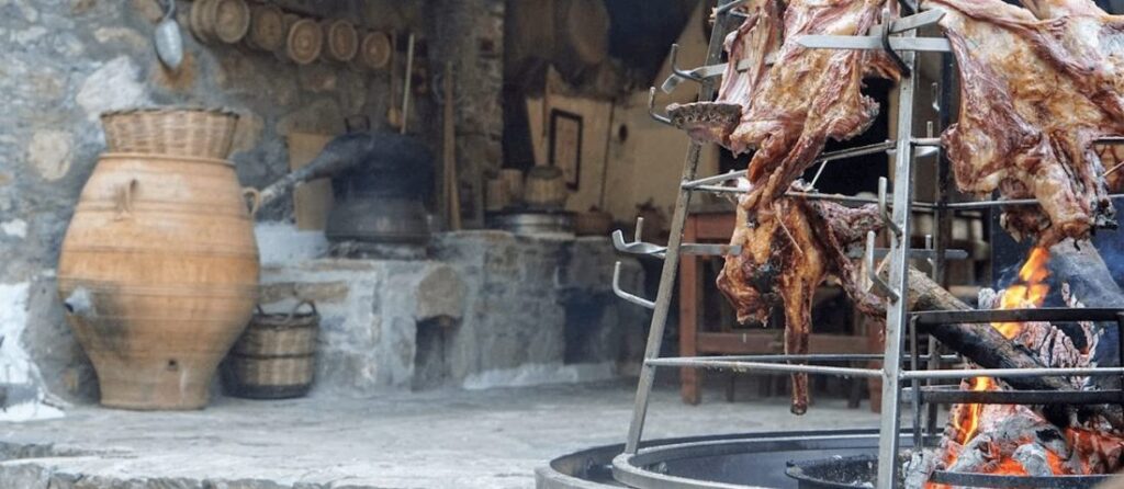 traditional Cretan grill with lamb and meats roasting over fire