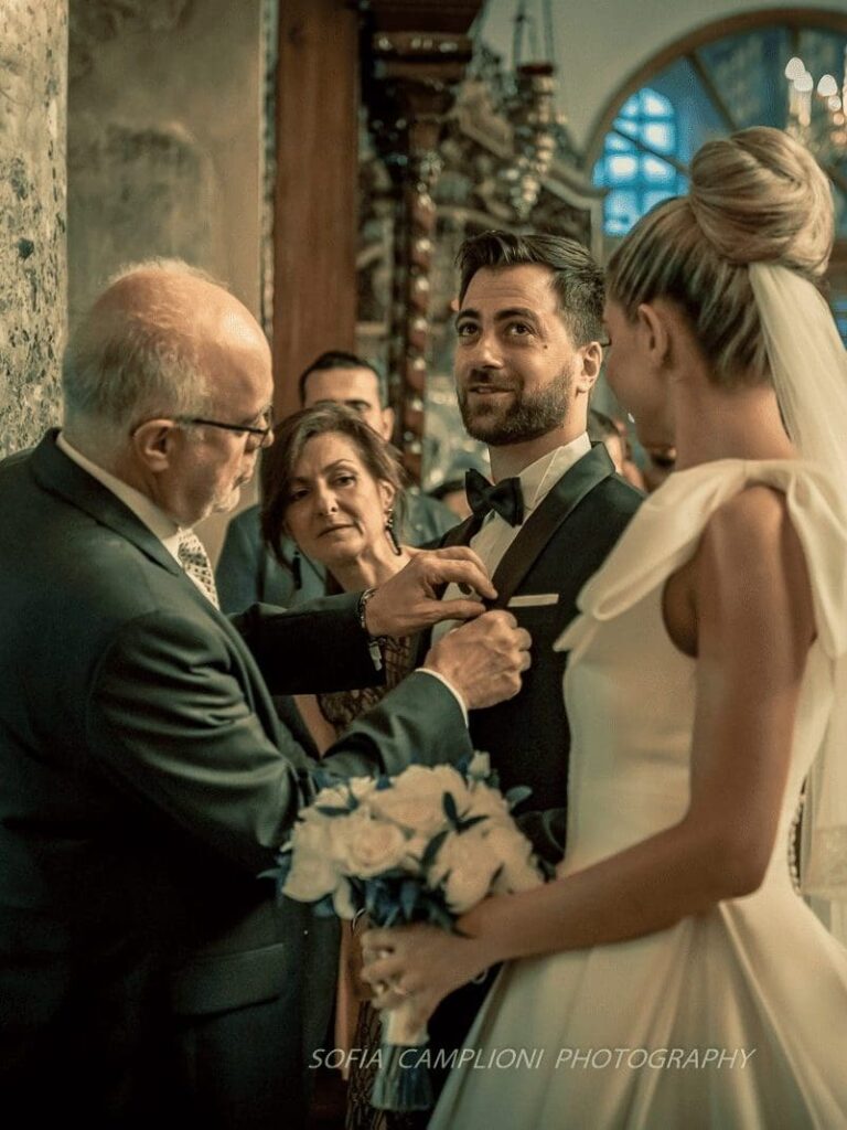 Couple getting married with a Greek Orthodox Ceremony in Greece.