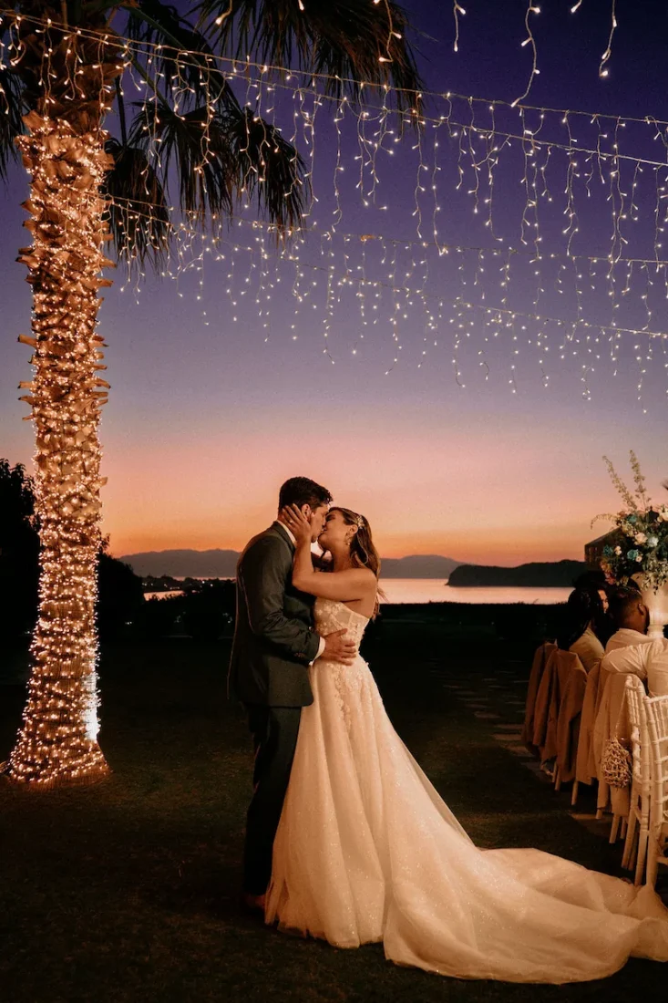 sea view by enkipo wedding venue in crete newlywed couple at dusk kissing