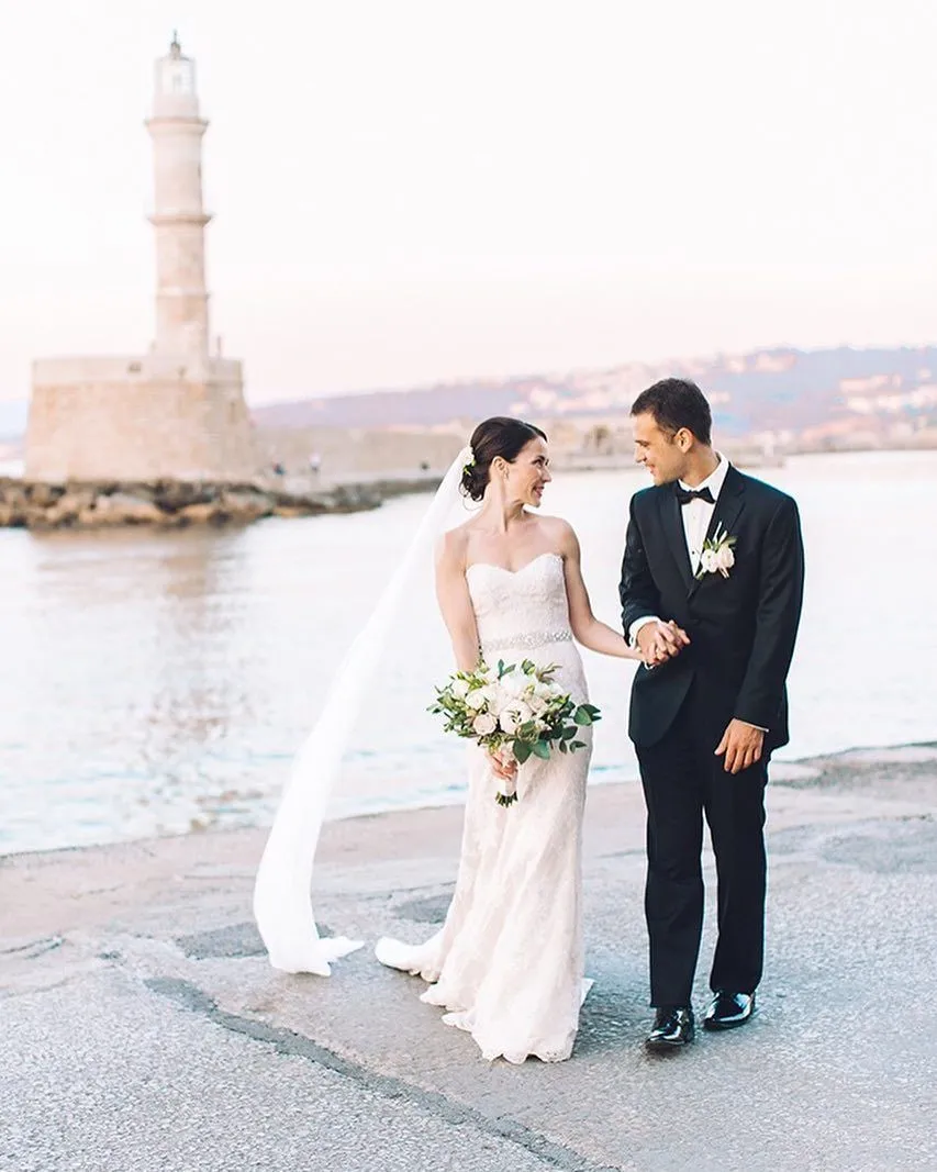 a newlywed couple eloping in greece at chania old harbor