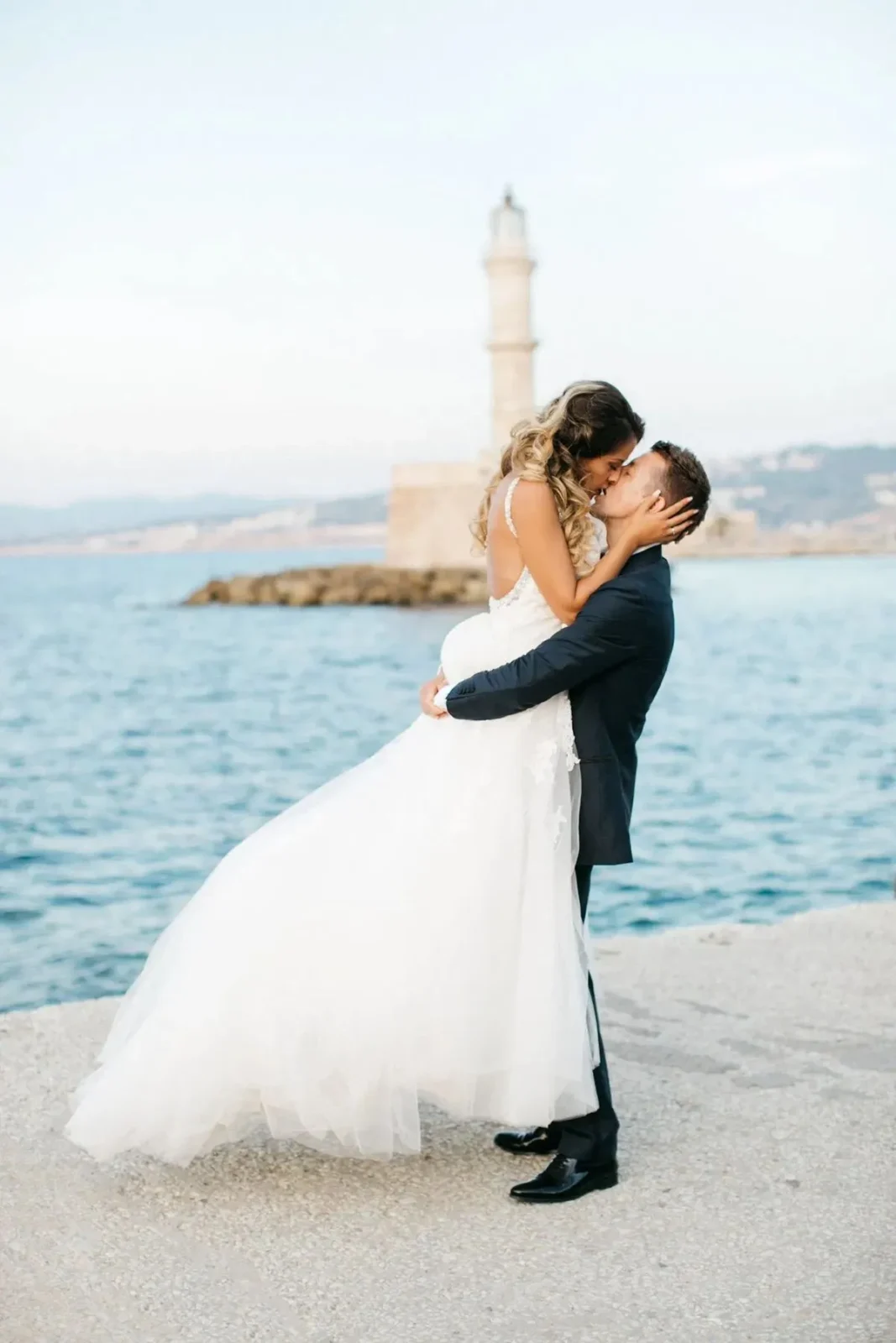 a newlywed couple eloping in greece at chania old harbor