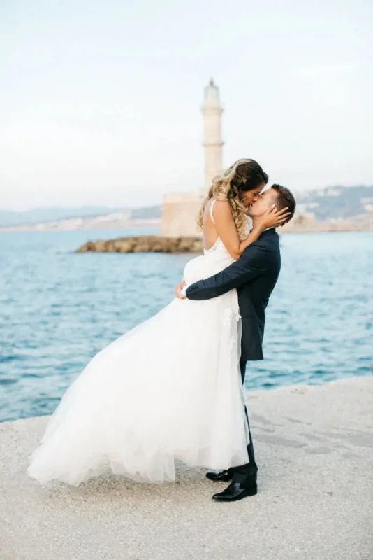 a newlywed couple eloping in greece at chania old harbor