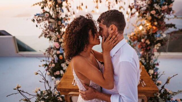 newlywed couple kissing at their santorini wedding