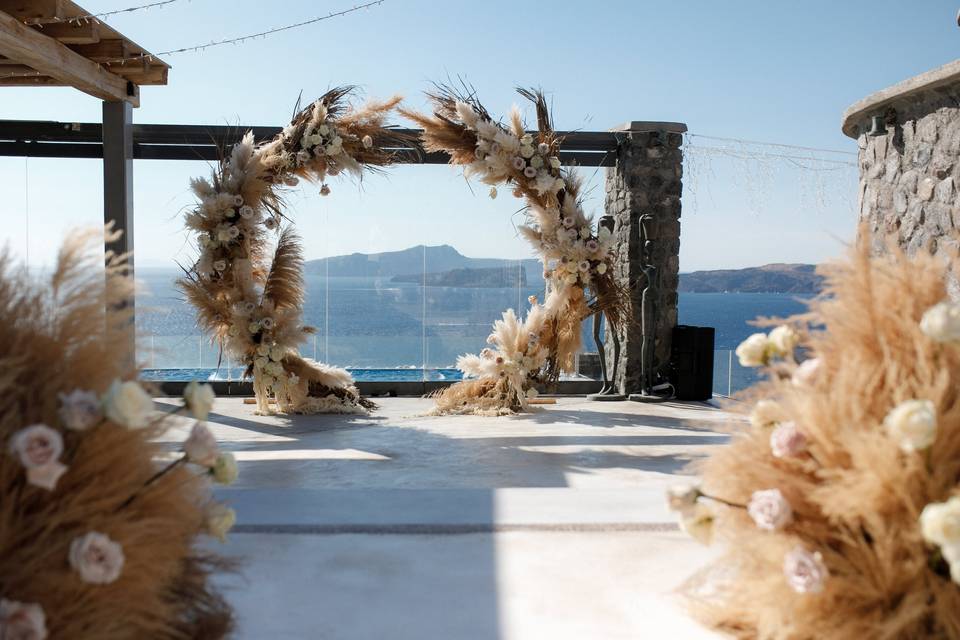 beautiful flower wedding arch in santorini