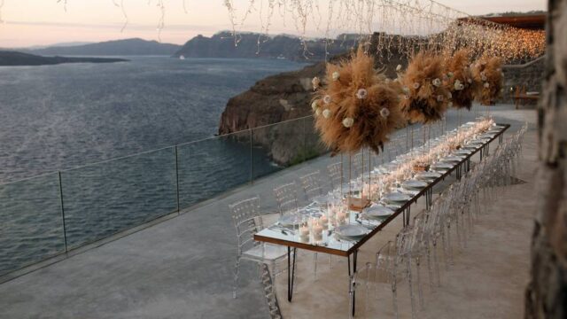 a long wedding table at a santorini wedding