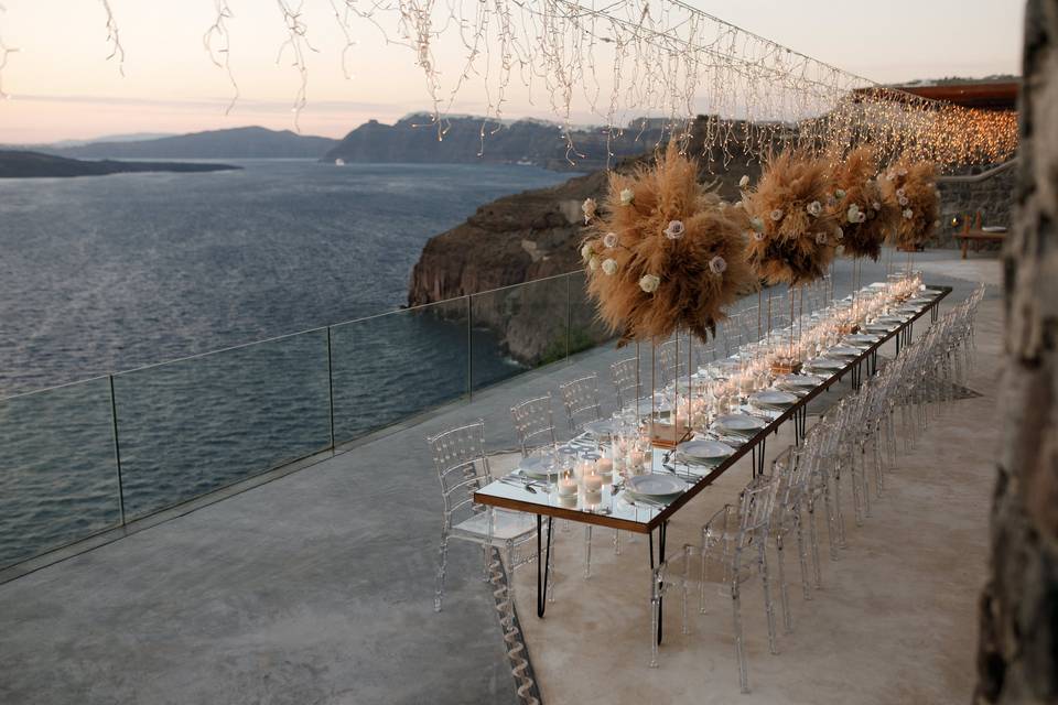 a long wedding table at a santorini wedding