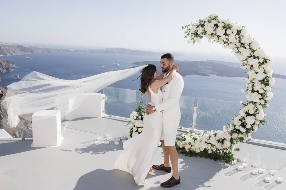 bride and groom embracing at a santorini wedding