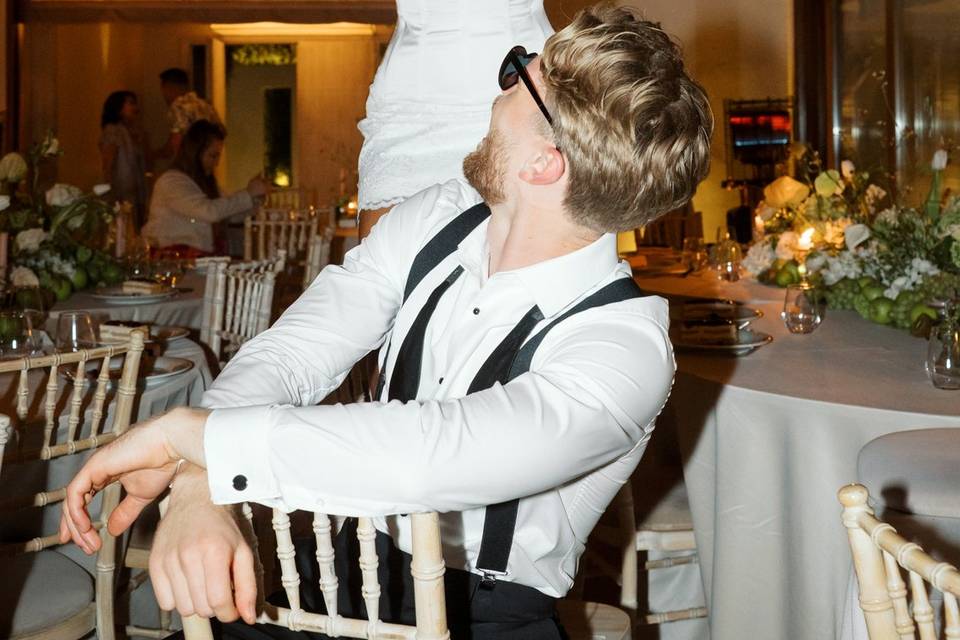 bride and groom goofing around at a greek wedding