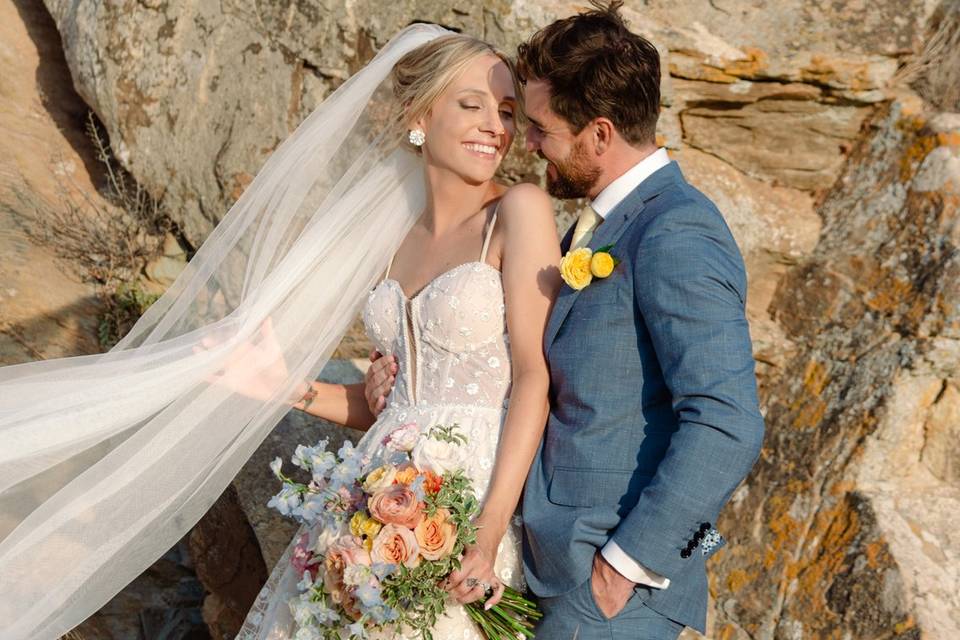 bride and groom posing at a santorini wedding