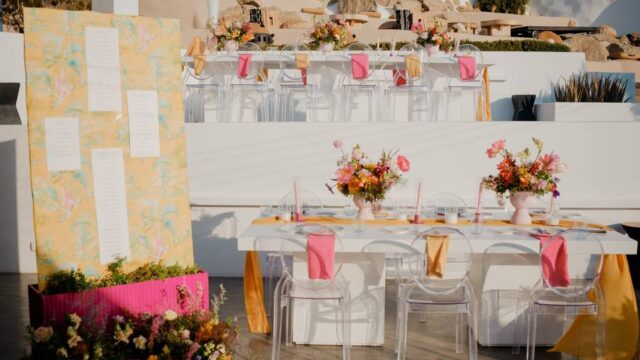 a table setup for a wedding in greece near the water