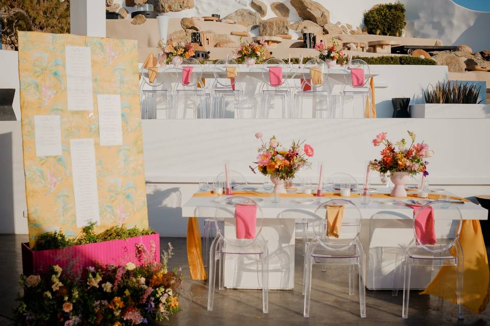 a table setup for a wedding in greece near the water