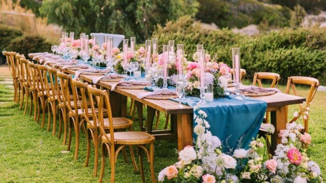 greed destination wedding table decorated with flowers and color