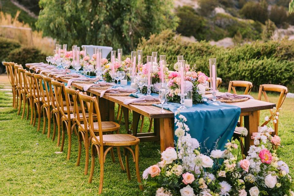 greed destination wedding table decorated with flowers and color
