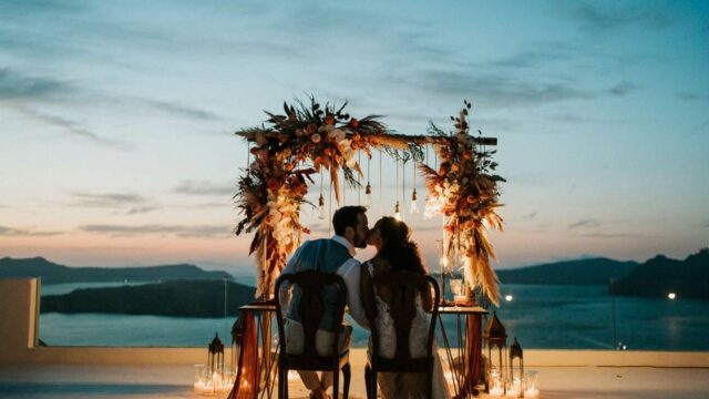 wedding in santorini and a view of the caldera in the backdrop