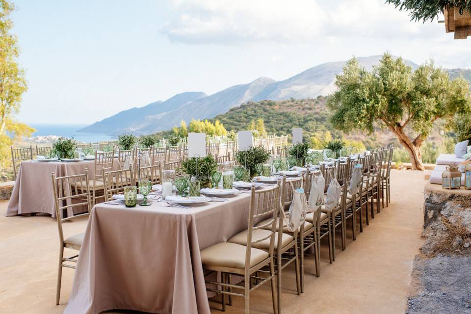 greece wedding tables with sea and mountains