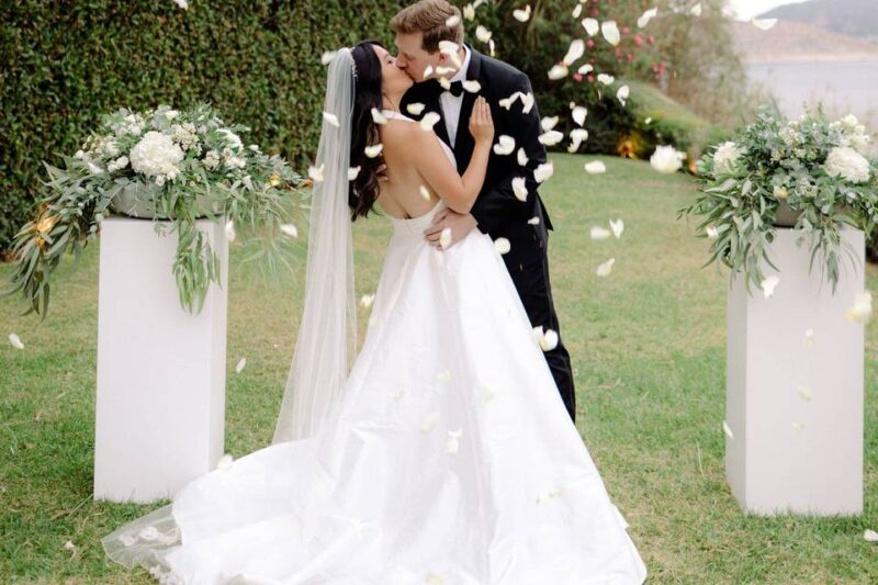 wedding couple kissing at greek wedding