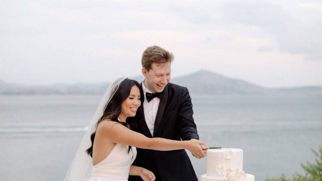 santorini destination wedding cutting cake