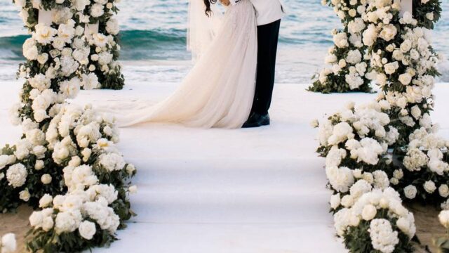 a couple getting married in Greece in front of the aegean sea