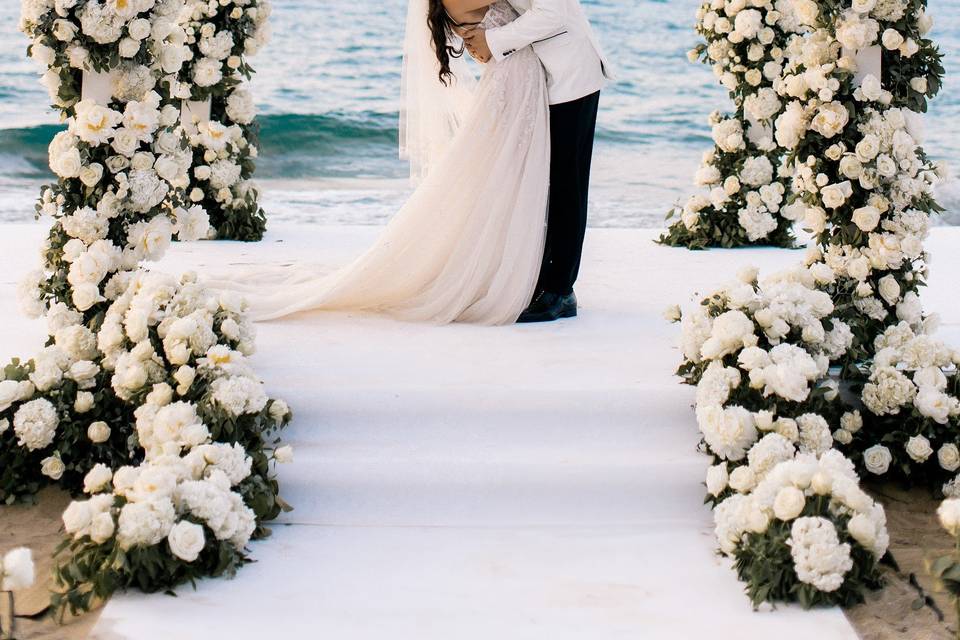 a couple getting married in Greece in front of the aegean sea
