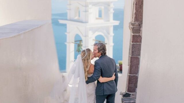 a wedding couple embracing at a wedding in greece