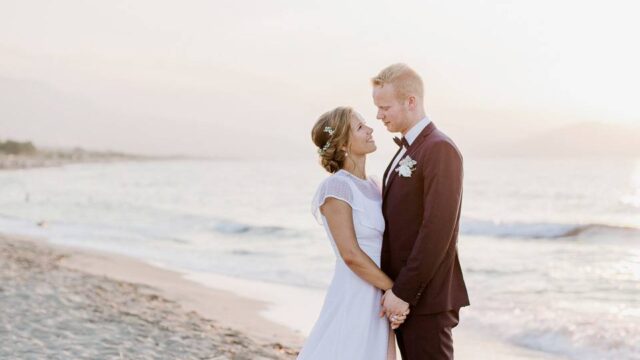 a wedding couple on the beach in greece
