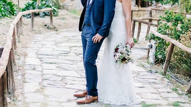 a wedding couple posing in greece