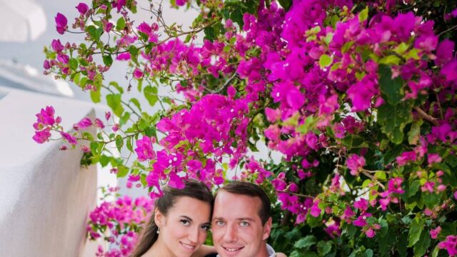 wedding couple posing with flowers at a greek wedding