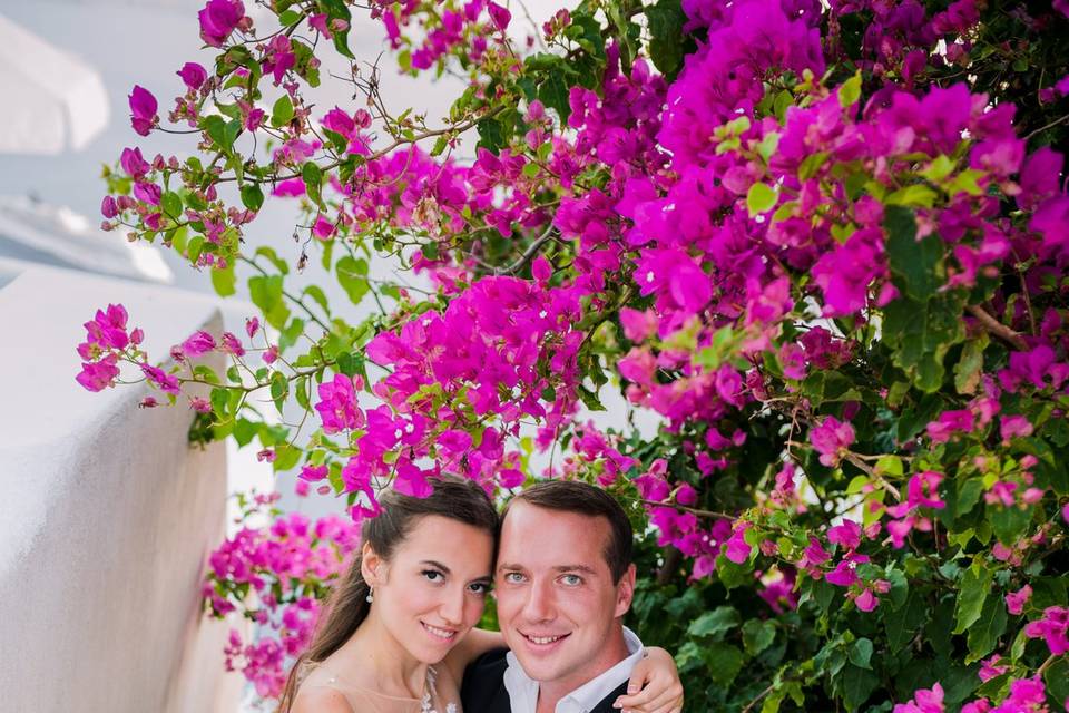 wedding couple posing with flowers at a greek wedding