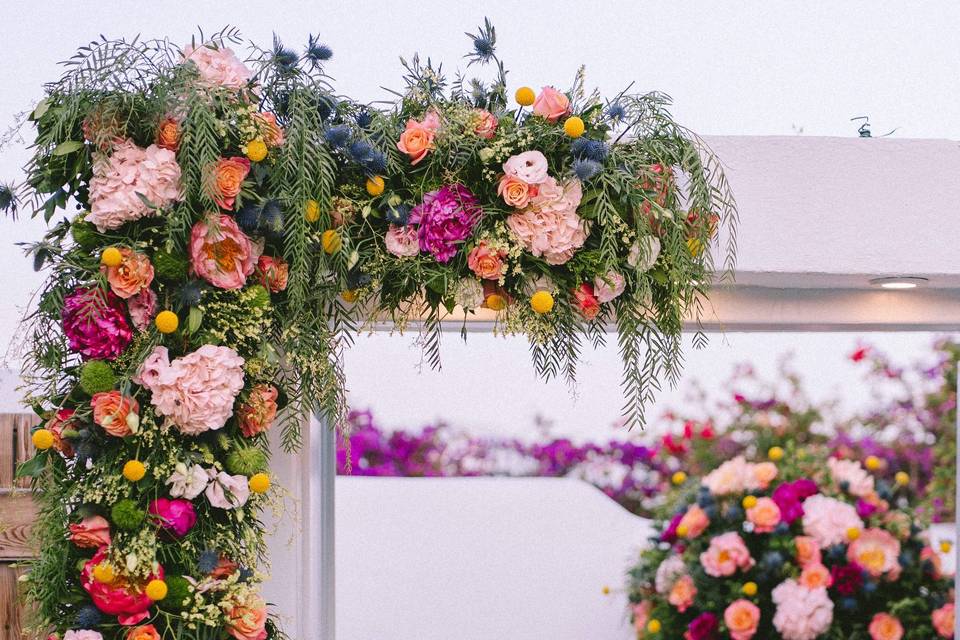 beautifully colored flowers at a greek wedding