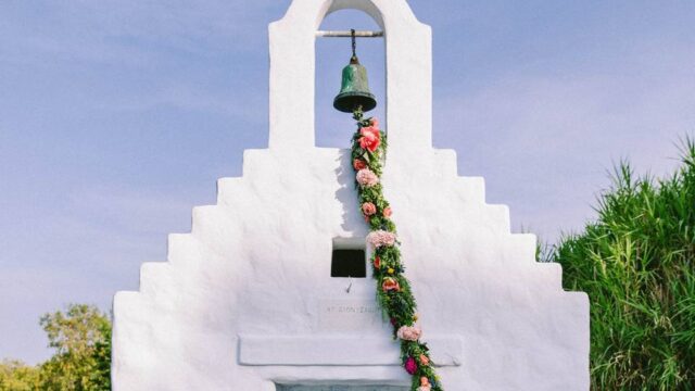beautifully decorated wedding chapel in greece with hanging flowers