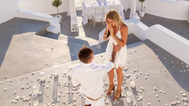 a bride excited by a proposal in santorini