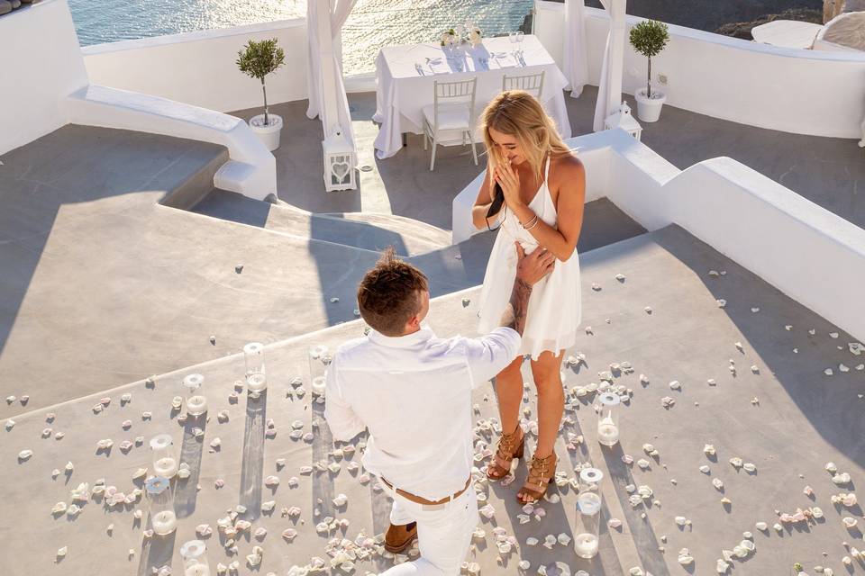 a bride excited by a proposal in santorini