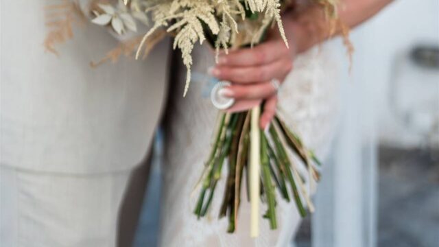 bride holding flower bouquet