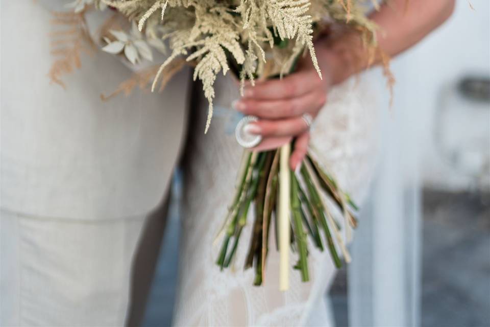 bride holding flower bouquet