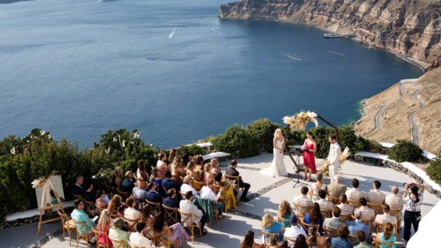 a wedding ceremony overlooking the sea in santorini