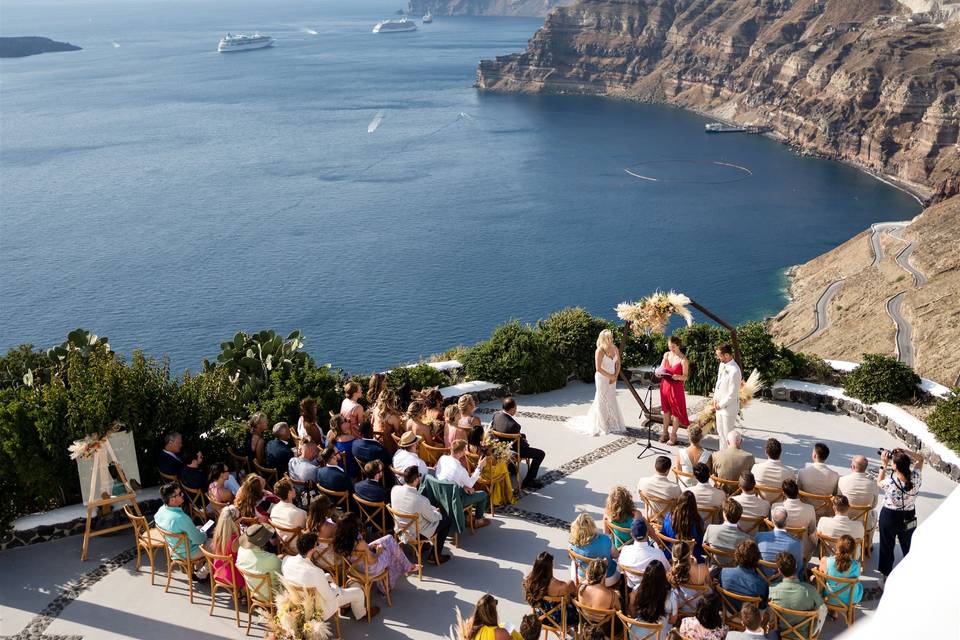 a wedding ceremony overlooking the sea in santorini
