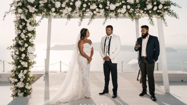 a wedding couple at a wedding ceremenoy in santorini