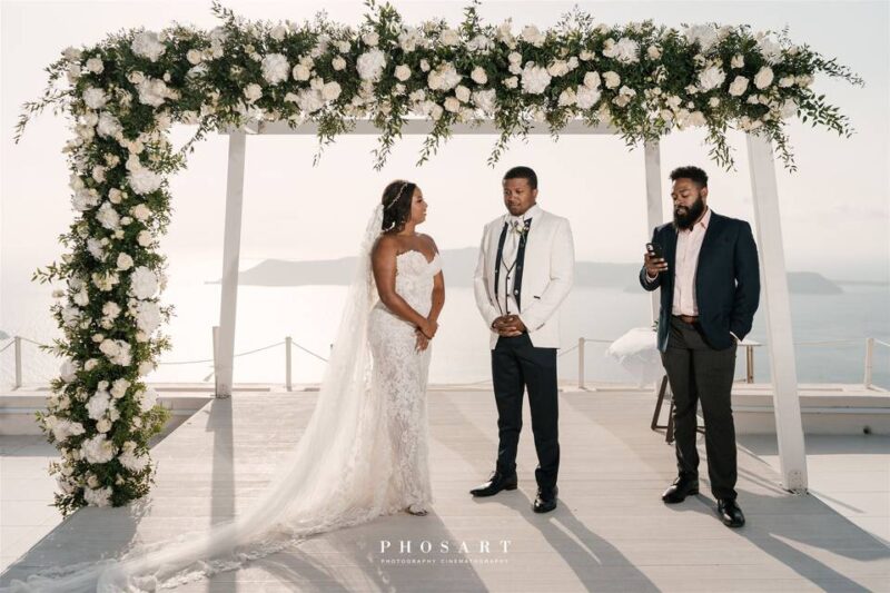 a wedding couple at a wedding ceremenoy in santorini