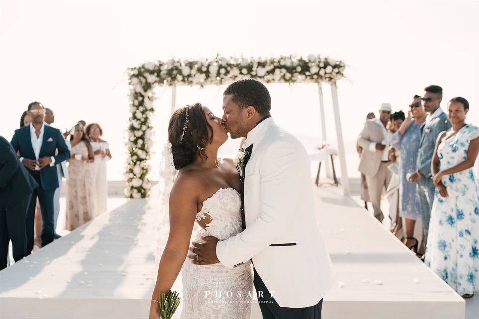a couple embracing at their wedding in santorini