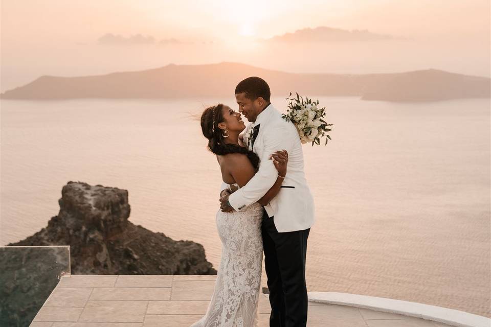 a couple embracing at in front of the aegean sea