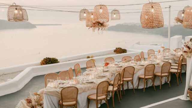 beautifully set tables for a wedding in santorinin