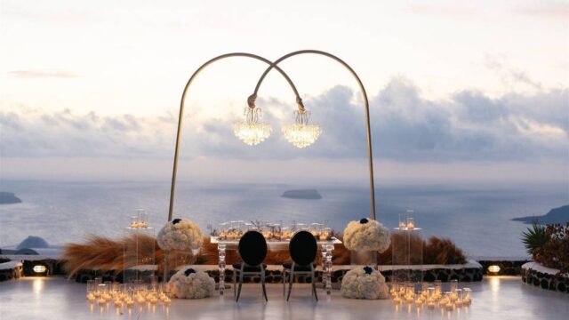 a chandelier table setup at a greek wedding