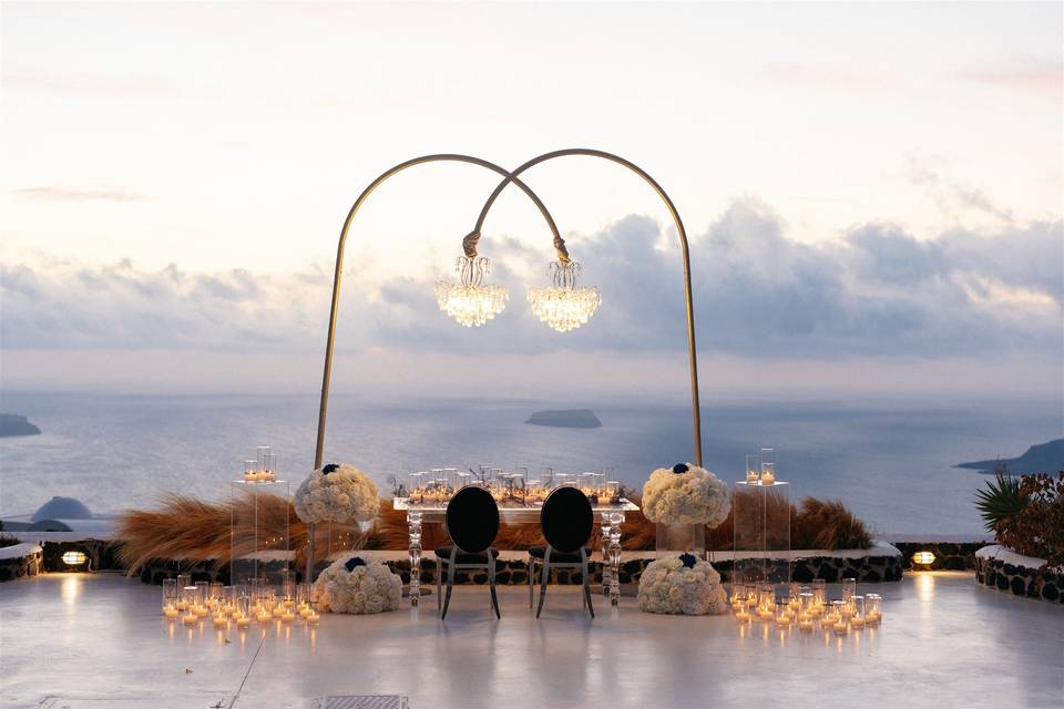 a chandelier table setup at a greek wedding