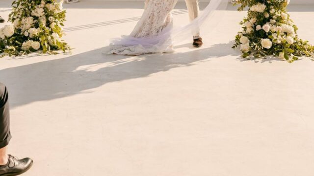 bride and groom posing at their greek wedding