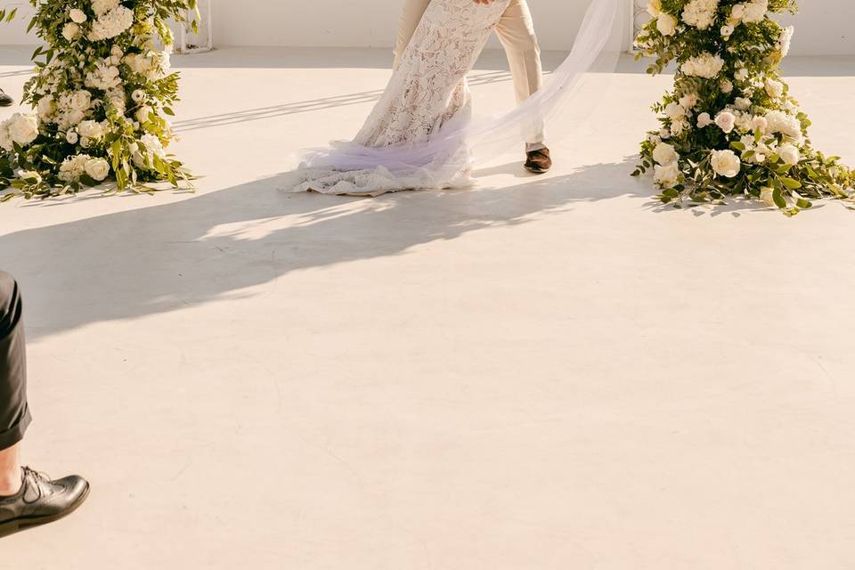 bride and groom posing at their greek wedding