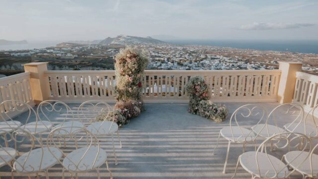 a wedding ceremony setup for a santorini wedding