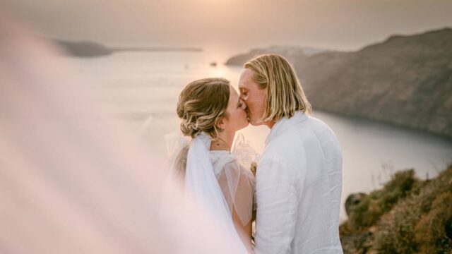 a couple embracing at their destination wedding santorini