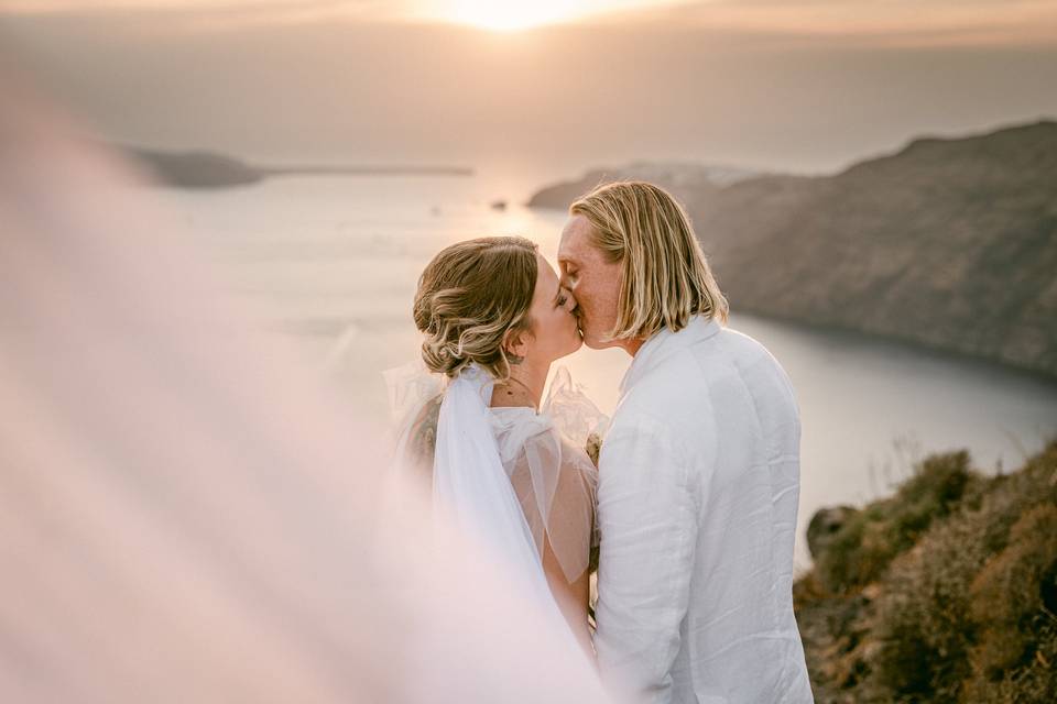 a couple embracing at their destination wedding santorini