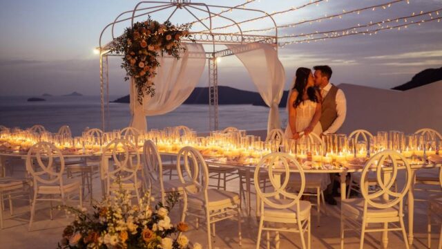 bride and groom kiss at their destination wedding santorini